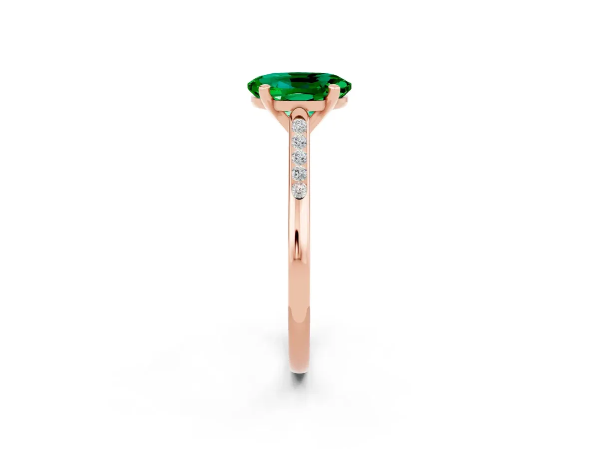 Oval Cut Emerald Solitaire Ring with Channel Set Round Band and Prong Setting Rose gold