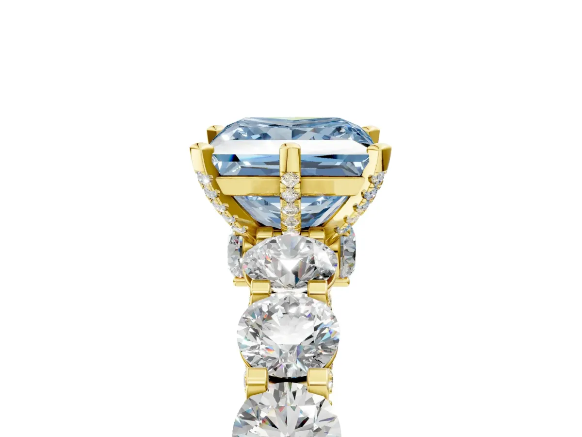 Fancy Blue Princess Cut Diamond Side Stone Engagement Ring with Four-Prong Setting Yellow gold