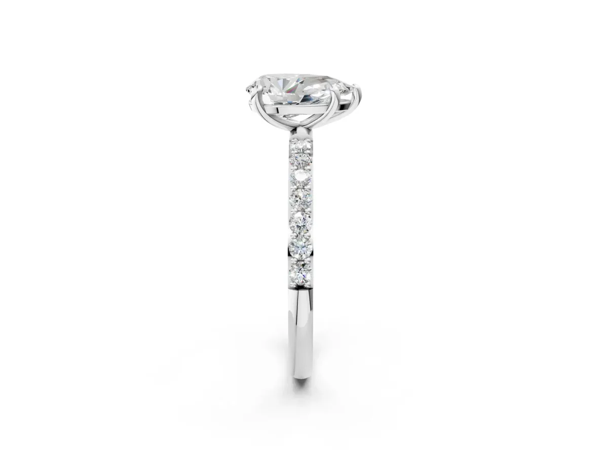Pear Cut Diamond Solitaire Ring with Round Moissanite Pavé Band and Prong Setting Silver