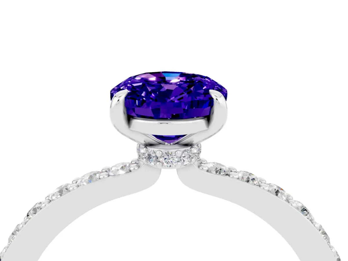 Oval Cut Tanzanite Solitaire Engagement Ring with Pavé Band and Four-Prong Setting Silver