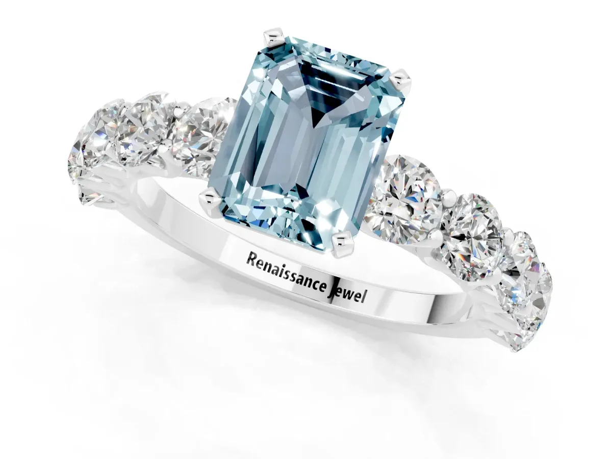 Emerald Cut Aquamarine Prong Setting with Side Stones on a Pave Band Silver