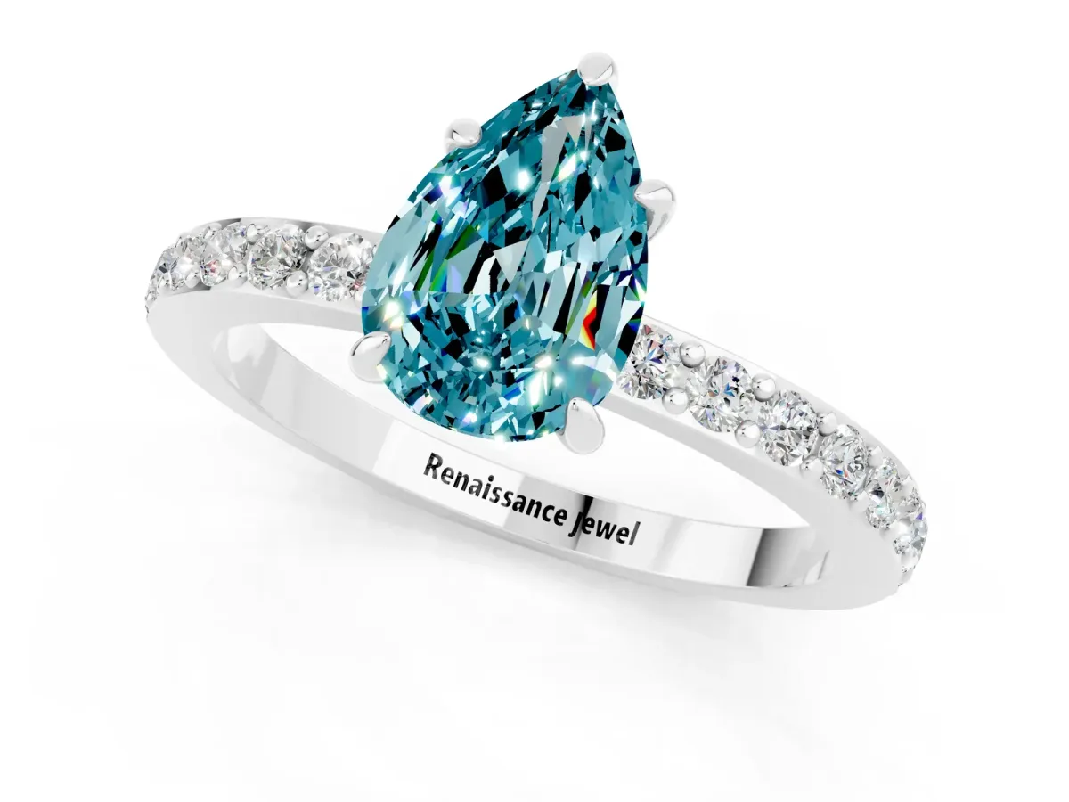 Pear Cut Blue Topaz Solitaire Engagement Ring with Pavé Band and Four-Prong Setting Silver
