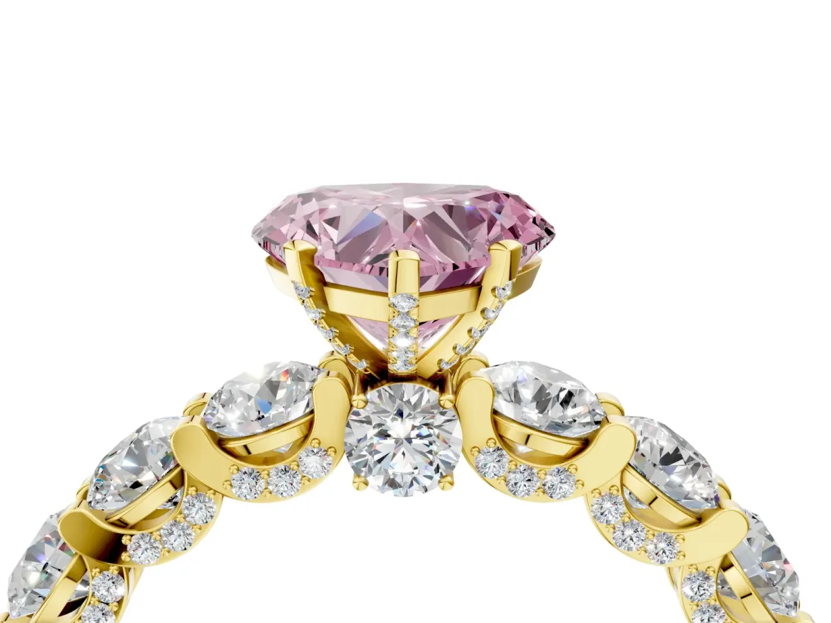 Fancy Pink Heart Cut Diamond Side Stone Engagement Ring with Four-Prong Setting Yellow gold