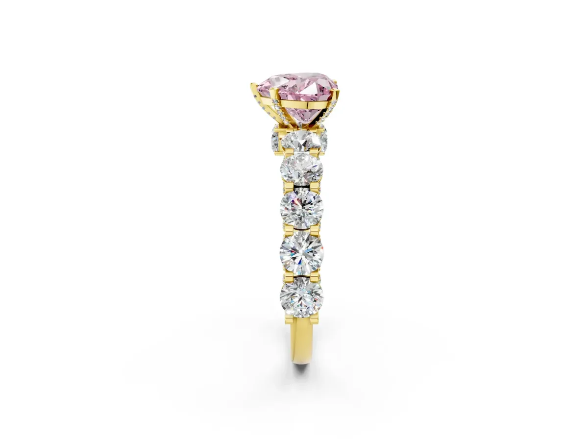 Fancy Pink Heart Cut Diamond Side Stone Engagement Ring with Four-Prong Setting Yellow gold
