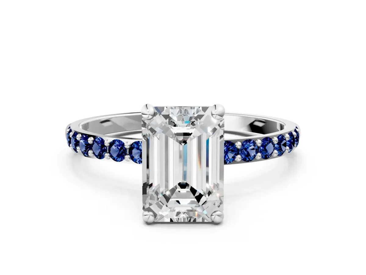 Emerald Cut Diamond Solitaire Ring with Round Blue Sapphire Pavé Band and Prong Setting Silver