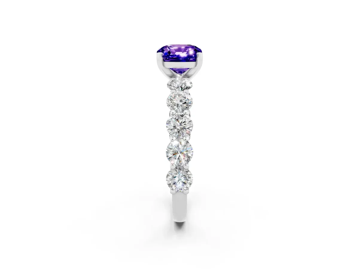 Cushion Cut Tanzanite Prong Setting with Side Stones on a Pave Band Silver