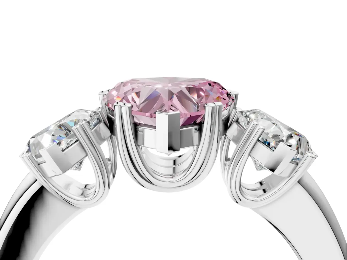Fancy Pink Three-Stone Heart Cut Cut Diamond Ring with Channel Set Band and Four-Prong Setting Silver