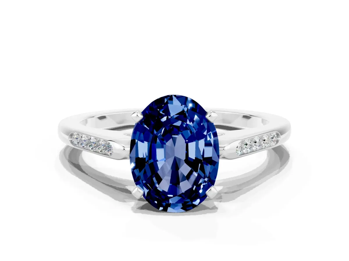 Oval Cut Blue Sapphire Solitaire Ring with Channel Set Round Band and Prong Setting Silver