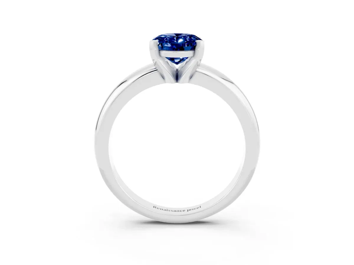 Oval Cut Blue Sapphire Solitaire Engagement Ring with Round Band and Four-Prong Setting Silver