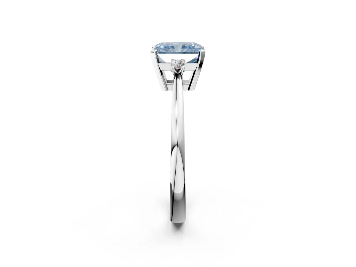 Fancy Blue Radiant Cut Cut Three-Stone Solitaire Ring with Round Accent Diamonds and Four-Prong Setting Platinum