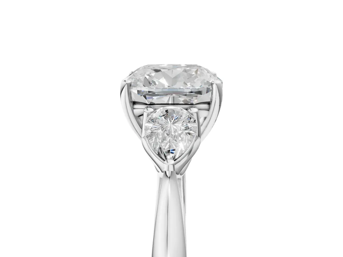 Three-Stone Cushion Cut Diamond Ring with Pear Side Stones in Four-Prong Setting White gold