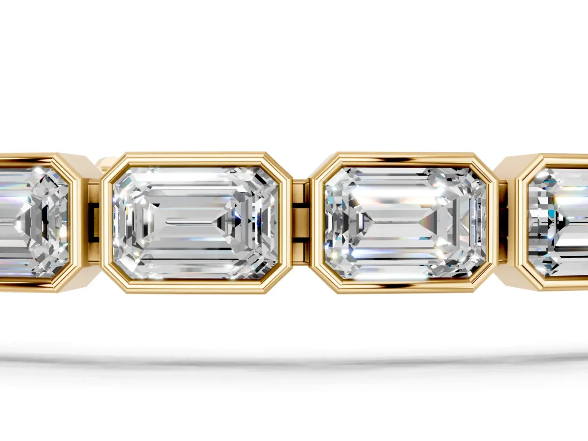 East-West Emerald Cut Diamond Tennis Bracelet with Bezel Setting Yellow gold