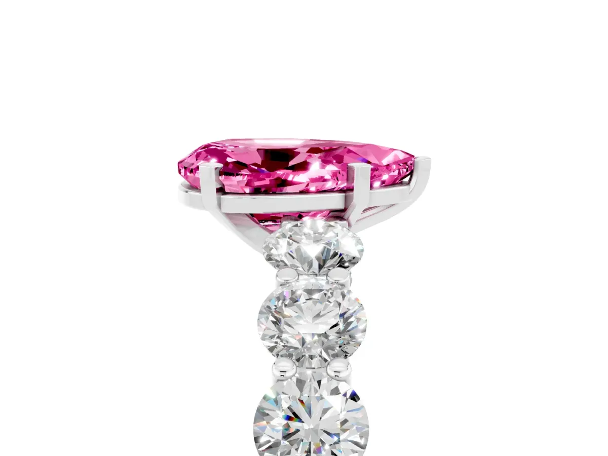 Pear Cut Pink Sapphire Prong Setting with Side Stones on a Pave Band Silver