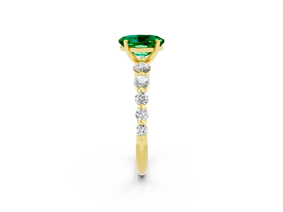 Oval Cut Solitaire Emerald Ring with Pave Band and Four-Prong Setting Yellow gold