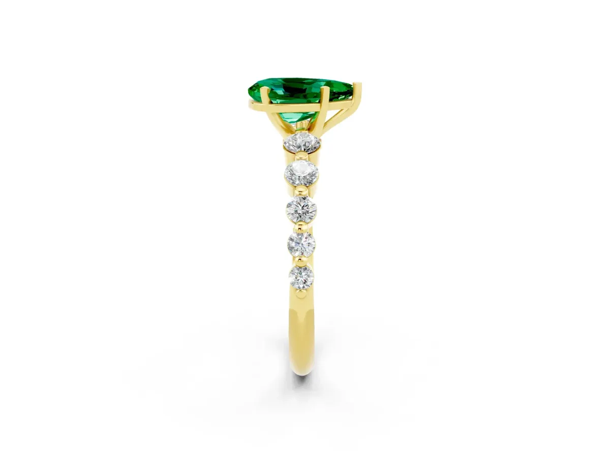 Pear Cut Solitaire Emerald Ring with Pave Band and Four-Prong Setting Yellow gold