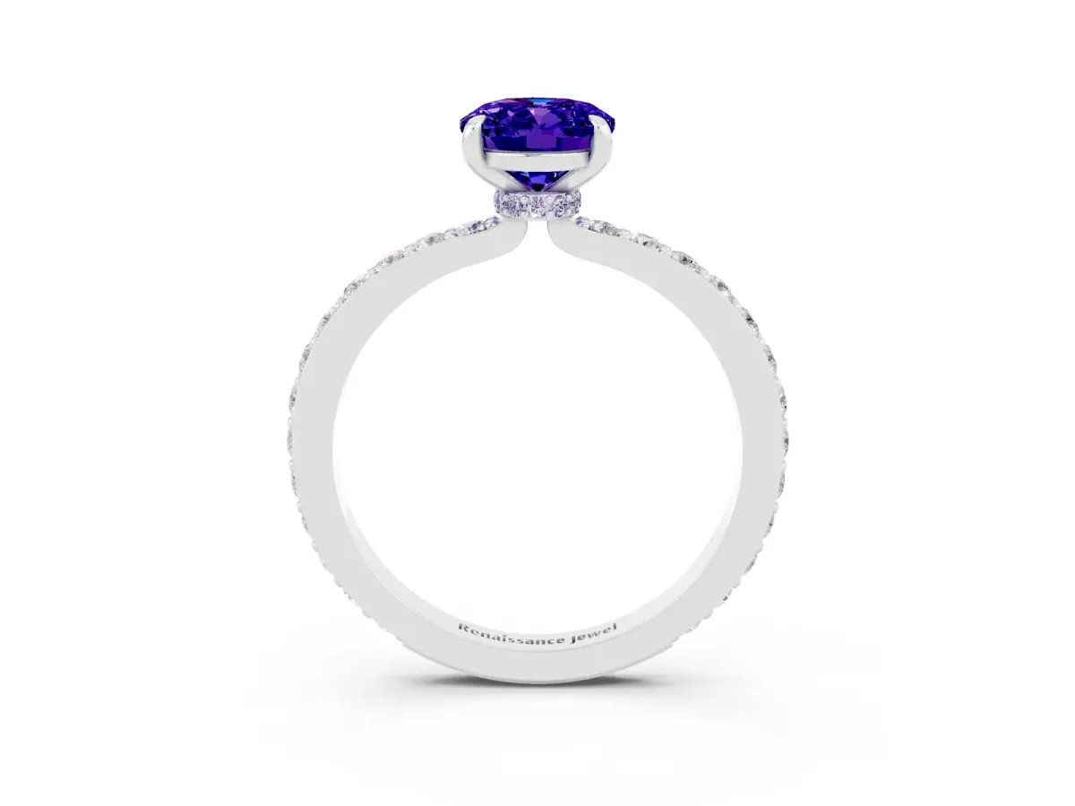 Oval Cut Tanzanite Solitaire Engagement Ring with Pavé Band and Four-Prong Setting Silver