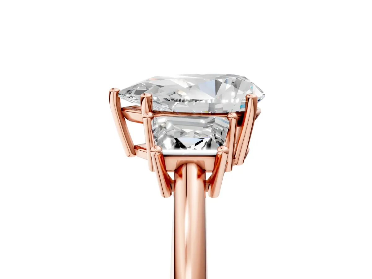 Pear Cut Diamond Three-Stone Ring with Trapezoid Side Stones and Prong Setting Rose gold