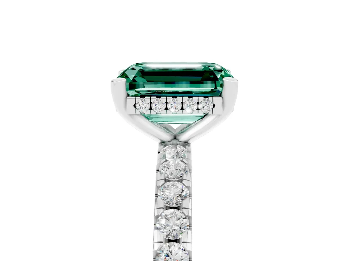 Emerald Cut Green Sapphire Solitaire Ring with Round Pavé Band and Four-Prong Setting Silver