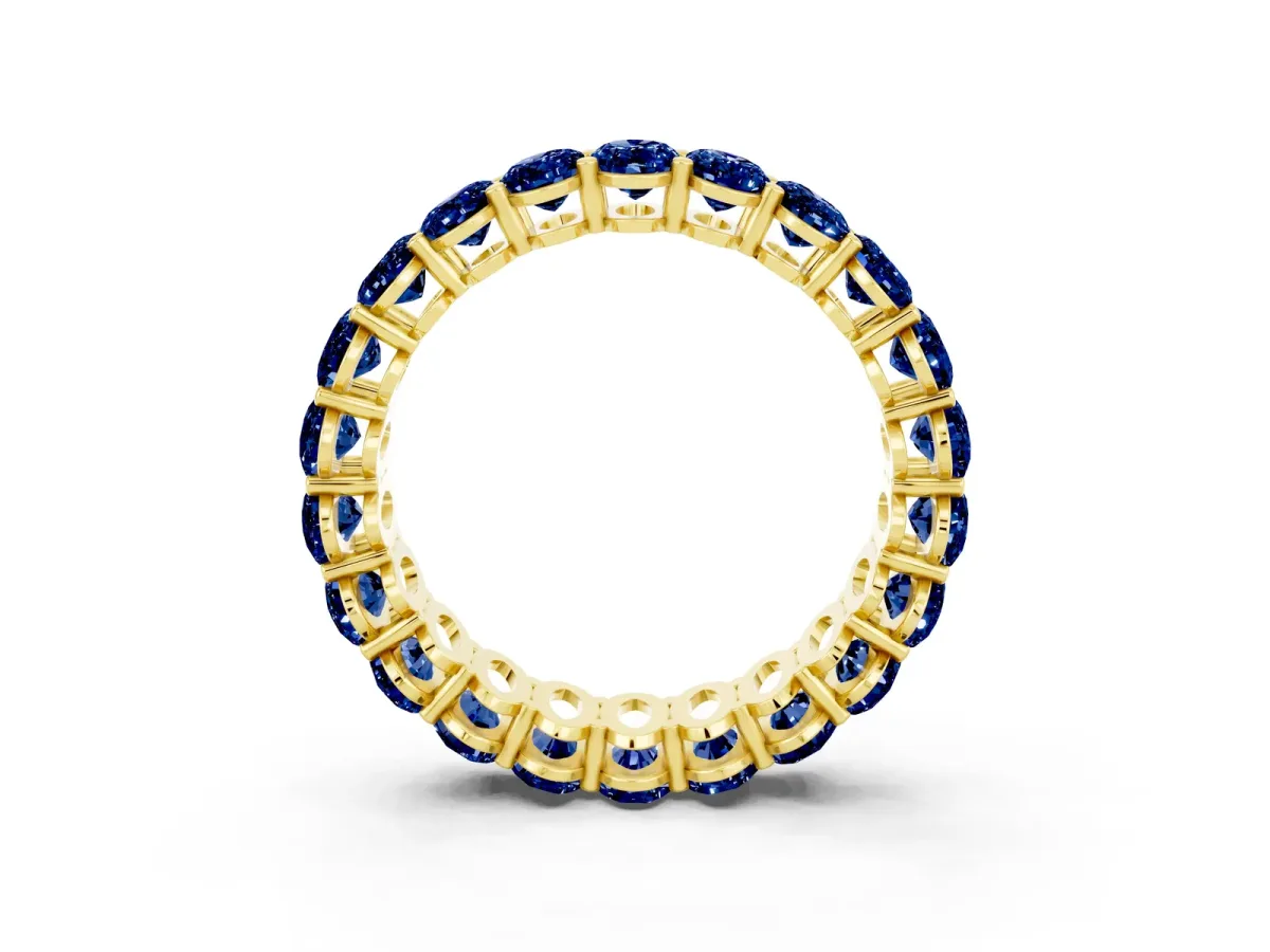 Oval Cut Blue Sapphire Eternity Band with Shared Prong Setting Yellow gold