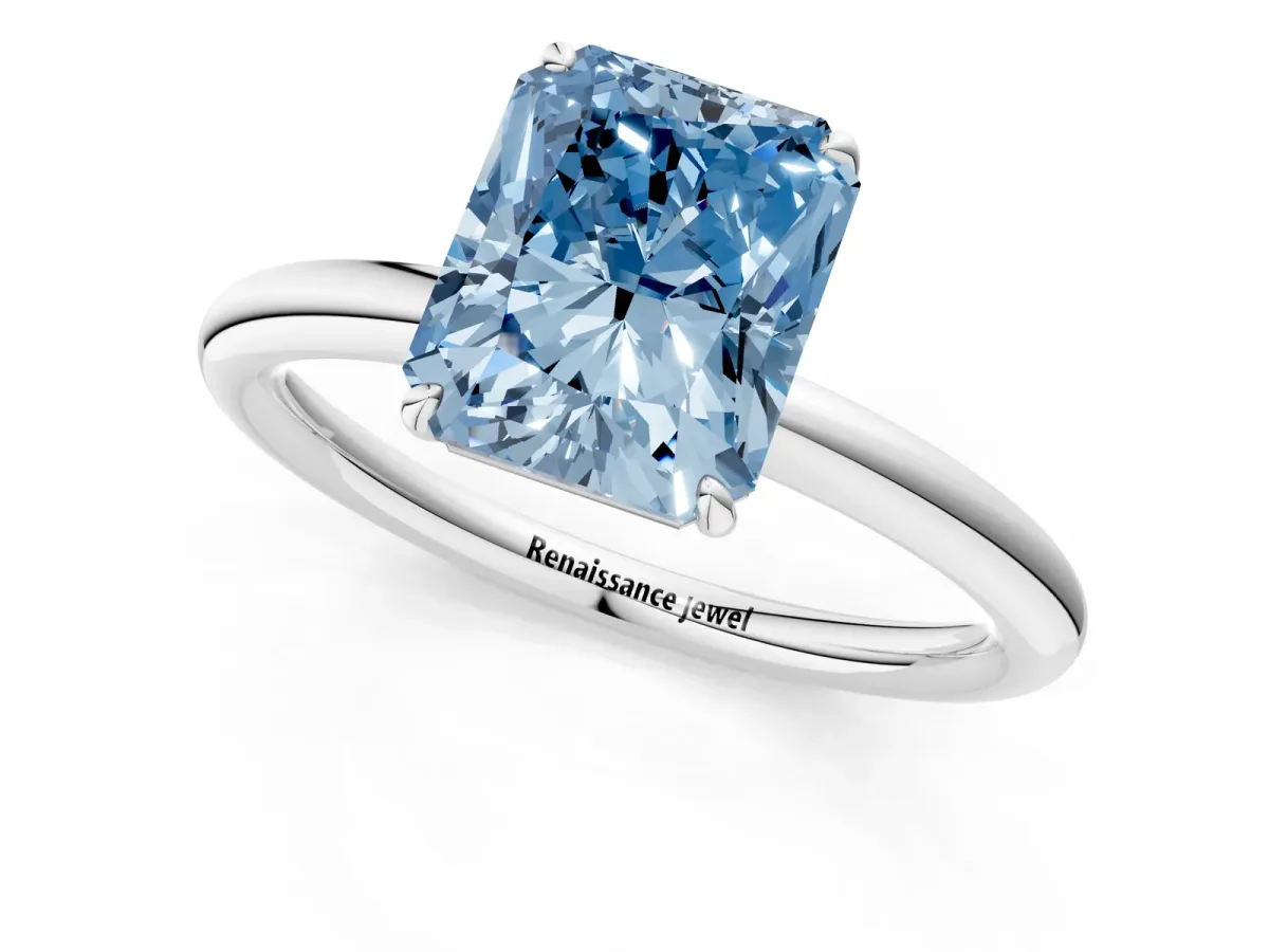 Fancy Blue Radiant Cut Solitaire Diamond Ring with Four-Prong Setting on a Plain Band Platinum