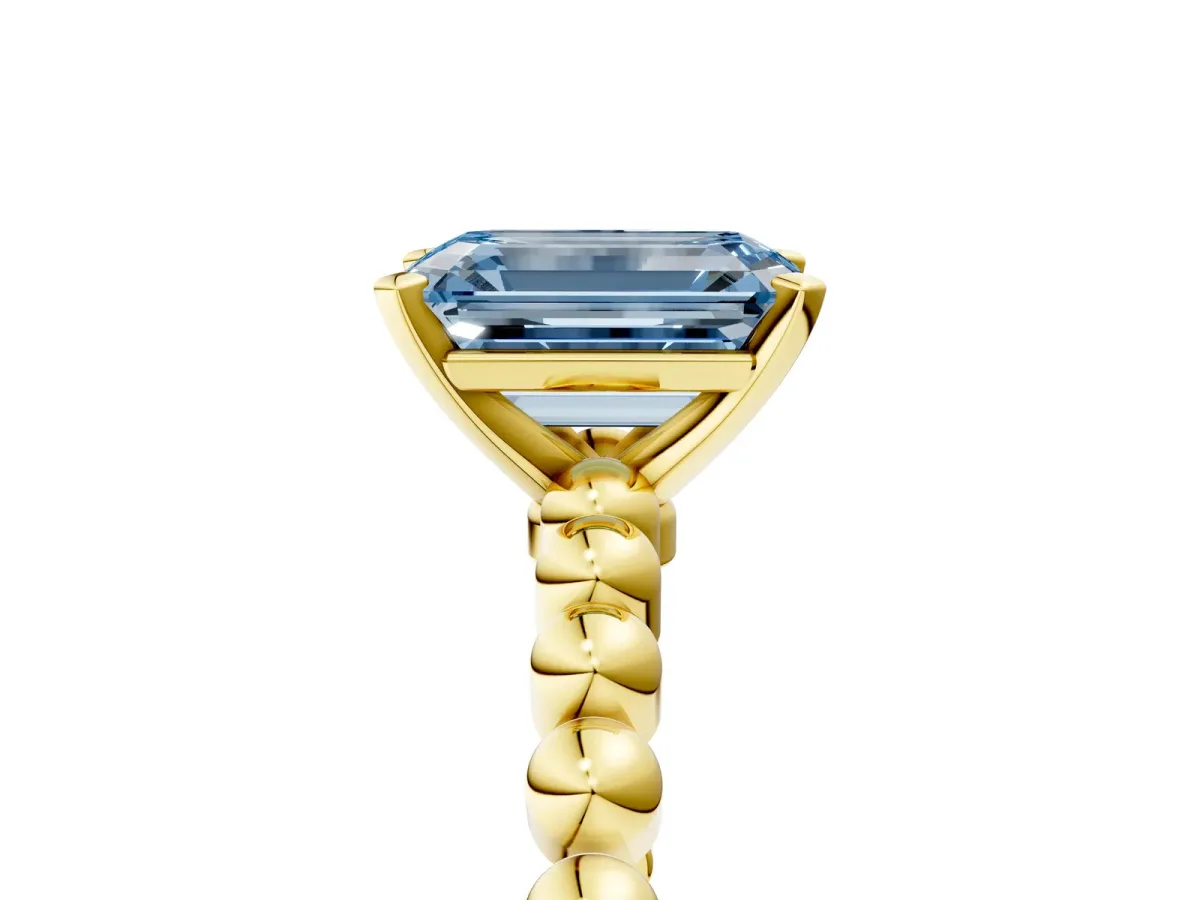 Fancy Blue Emerald Cut Diamond Solitaire Ring with Beaded Band and Prong Setting Yellow gold