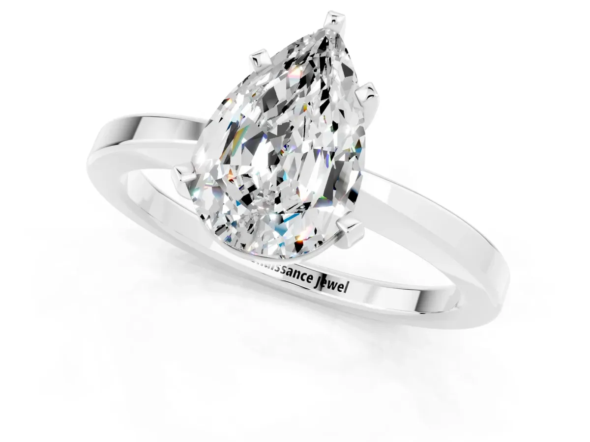 Pear Cut Moissanite Solitaire Engagement Ring with Classic Band and Four-Prong Setting Silver