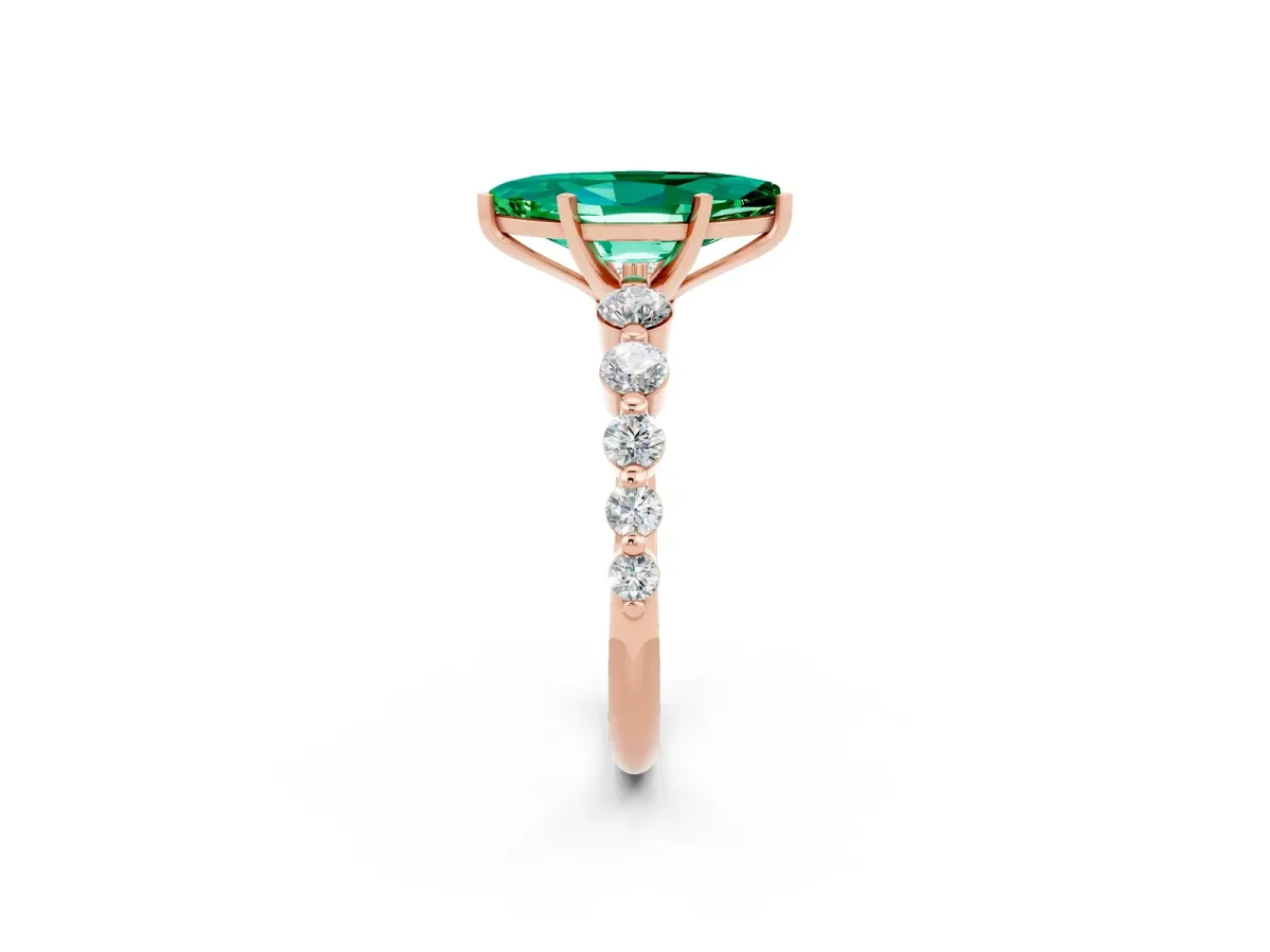 Marquise Cut Solitaire Emerald Ring with Pave Band and Four-Prong Setting Rose gold