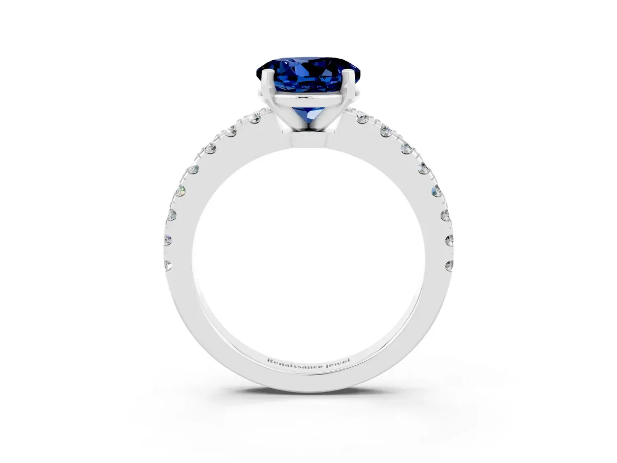 Round Cut Solitaire Blue Sapphire with Pavé Band and Four-Prong Setting Silver