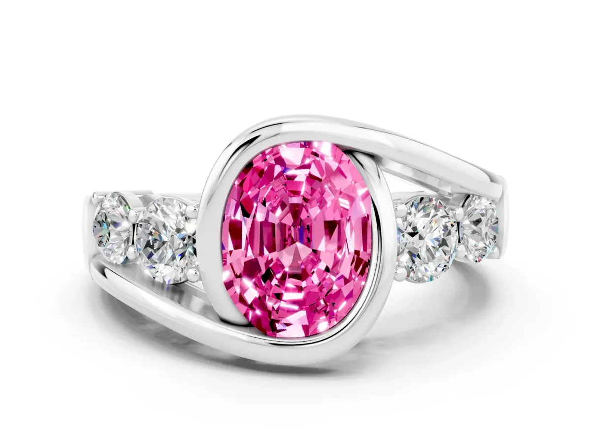 Bezel Set Oval Cut Pink Sapphire Bypass Ring with Round Accents Platinum