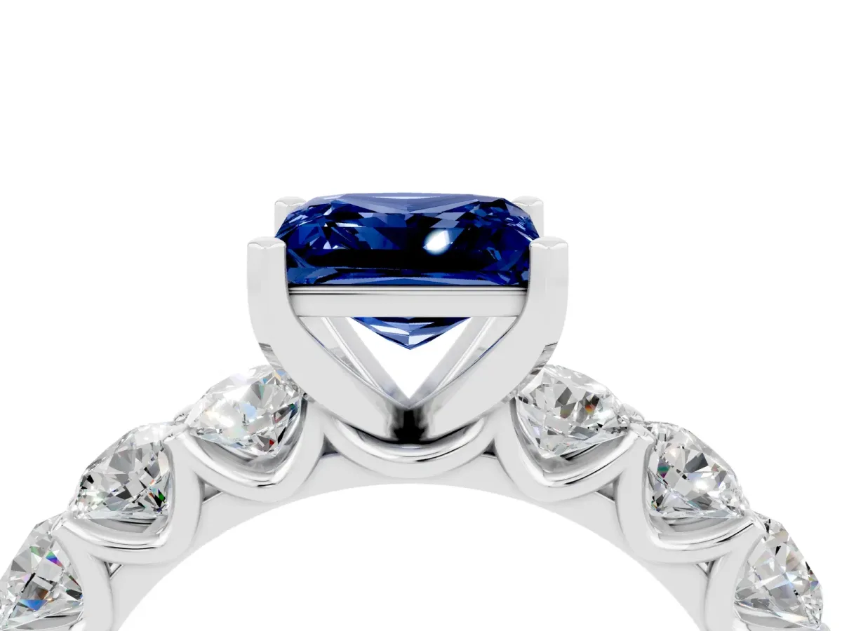 Princess Cut Blue Sapphire Prong Setting with Side Stones on a Pave Band Silver