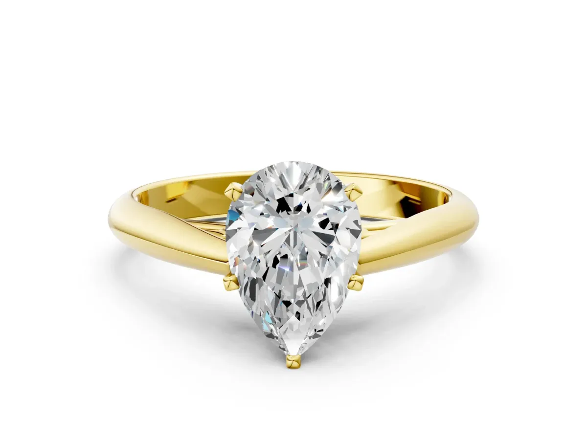 Pear Cut Diamond Solitaire Engagement Ring with Cathedral Setting and Four-Prong Mount Yellow gold