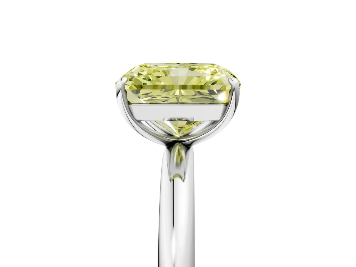 Fancy Yellow Radiant Cut Solitaire Diamond Ring with Four-Prong Setting on a Plain Band Platinum