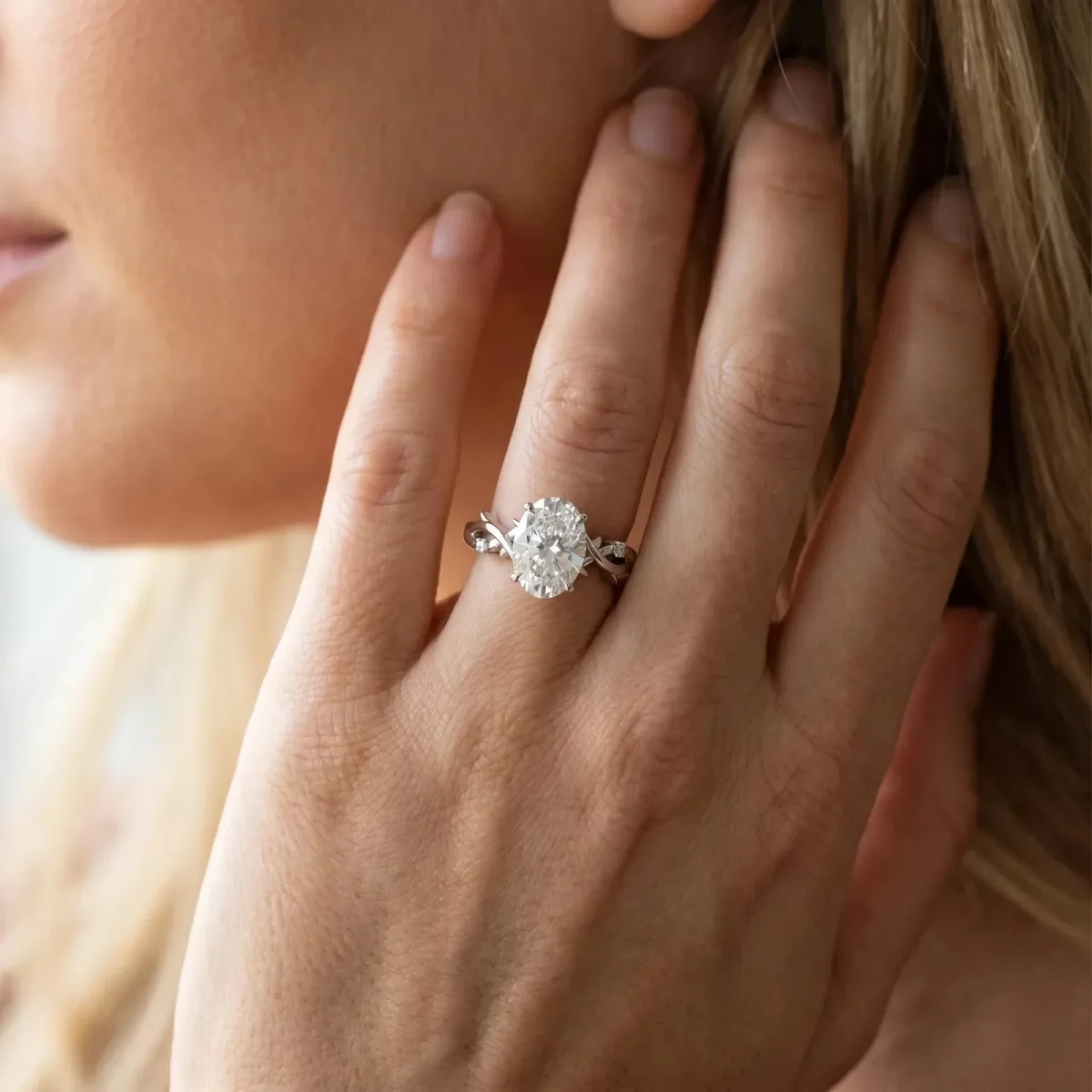 Oval Cut Diamond Solitaire Ring with Twisted Band and Prong Setting Platinum