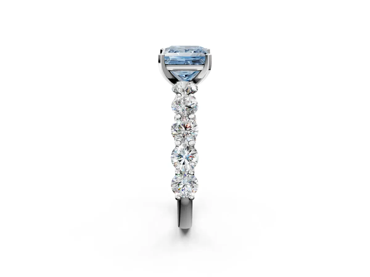 Fancy Blue Princess Cut Diamond Prong Setting with Side Stones on a Pave Band Silver