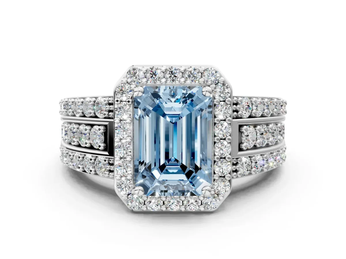 Fancy Blue Emerald Cut Halo Diamond Ring with Round Split Shank and Prong Setting Platinum