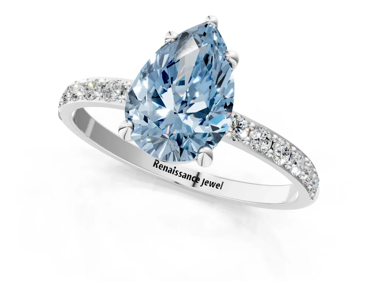 Fancy Blue Pear Cut Diamond Solitaire Ring with Round Pavé Band and Prong Setting Platinum
