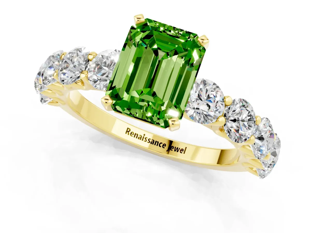 Emerald Cut Peridot Prong Setting with Side Stones on a Pave Band Yellow gold