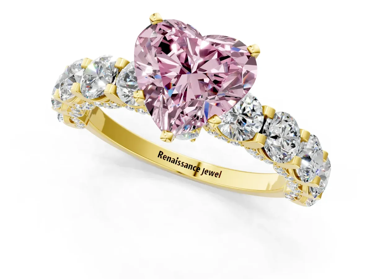 Fancy Pink Heart Cut Diamond Side Stone Engagement Ring with Four-Prong Setting Yellow gold
