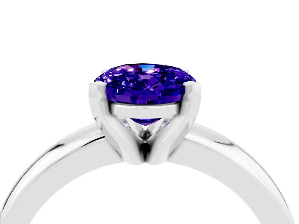 Oval Cut Tanzanite Solitaire Engagement Ring with Round Band and Four-Prong Setting Silver