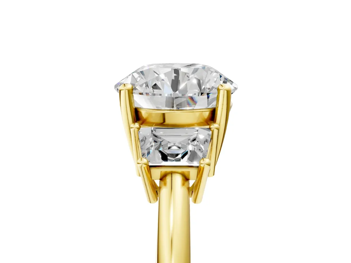 Round Cut Diamond Three-Stone Ring with Trapezoid Side Stones and Prong Setting Yellow gold