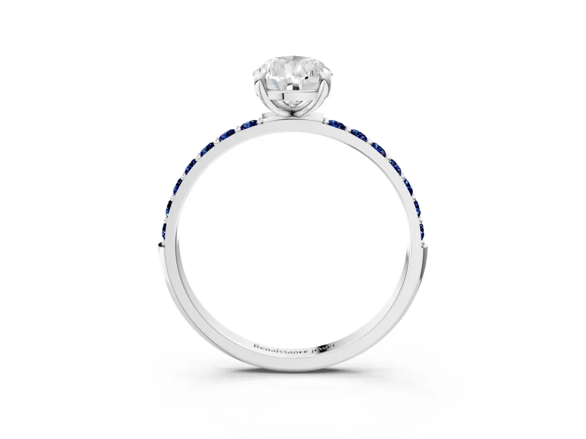 Pear Cut Diamond Solitaire Ring with Round Blue Sapphire Pavé Band and Prong Setting Silver