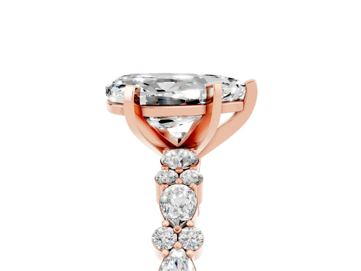 Pear Cut Moissanite Side Stone Solitaire Ring with Round and Four-Prong Setting Rose gold