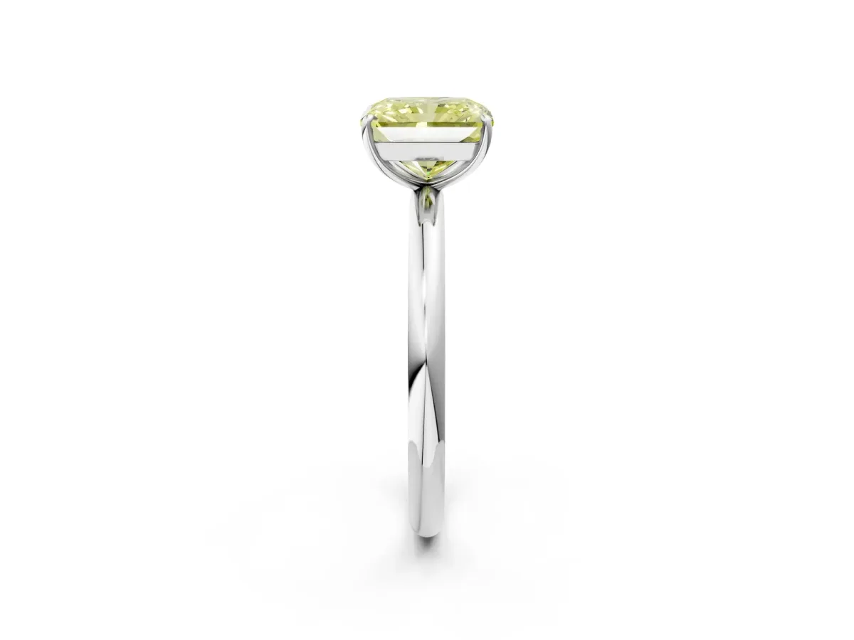 Fancy Yellow Radiant Cut Solitaire Diamond Ring with Four-Prong Setting on a Plain Band Platinum