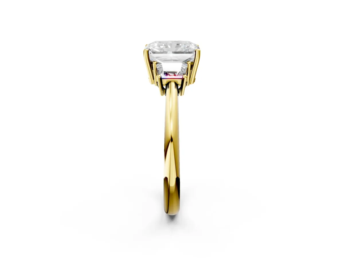 Radiant Cut Diamond Three-Stone Ring with Trapezoid Side Stones and Prong Setting Yellow gold