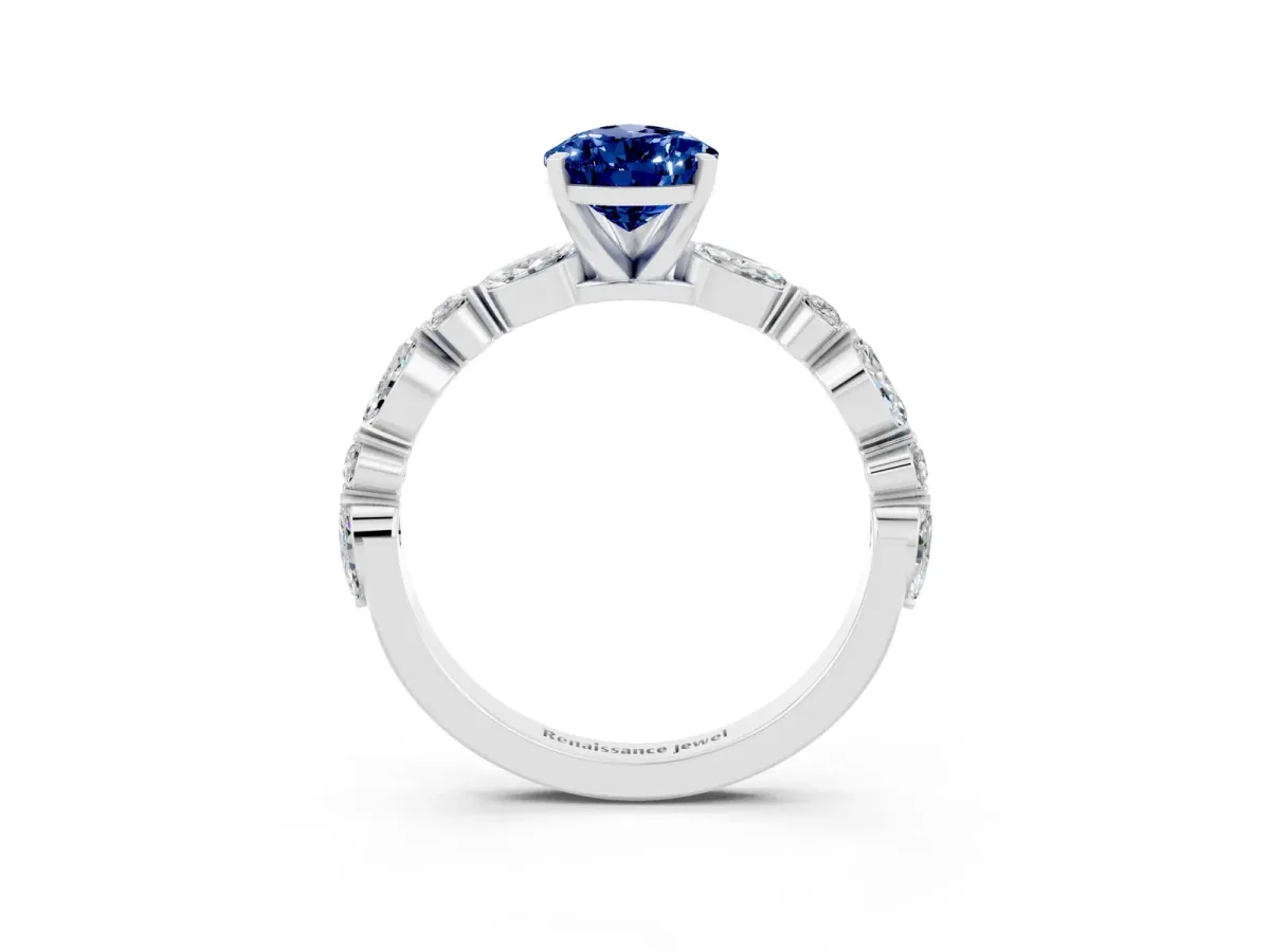 Pear Cut Blue Sapphire Ring with Marquise and Round Side Stones and Four-Prong Setting Silver