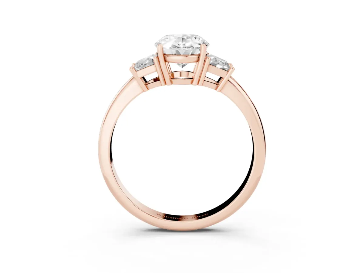 Oval Cut Diamond Three-Stone Ring with Trapezoid Side Stones and Prong Setting Rose gold