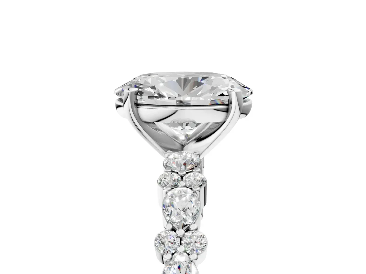 Oval Cut Diamond Side Stone Solitaire Ring with Round Moissanite and Four-Prong Setting Silver