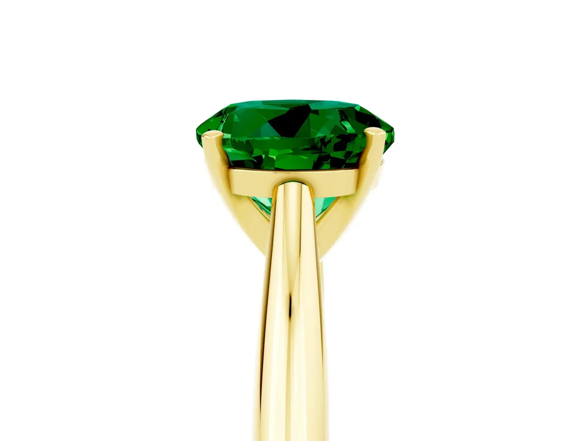 Round Cut Emerald Solitaire Engagement Ring with Cathedral Setting and Four-Prong Mount Yellow gold