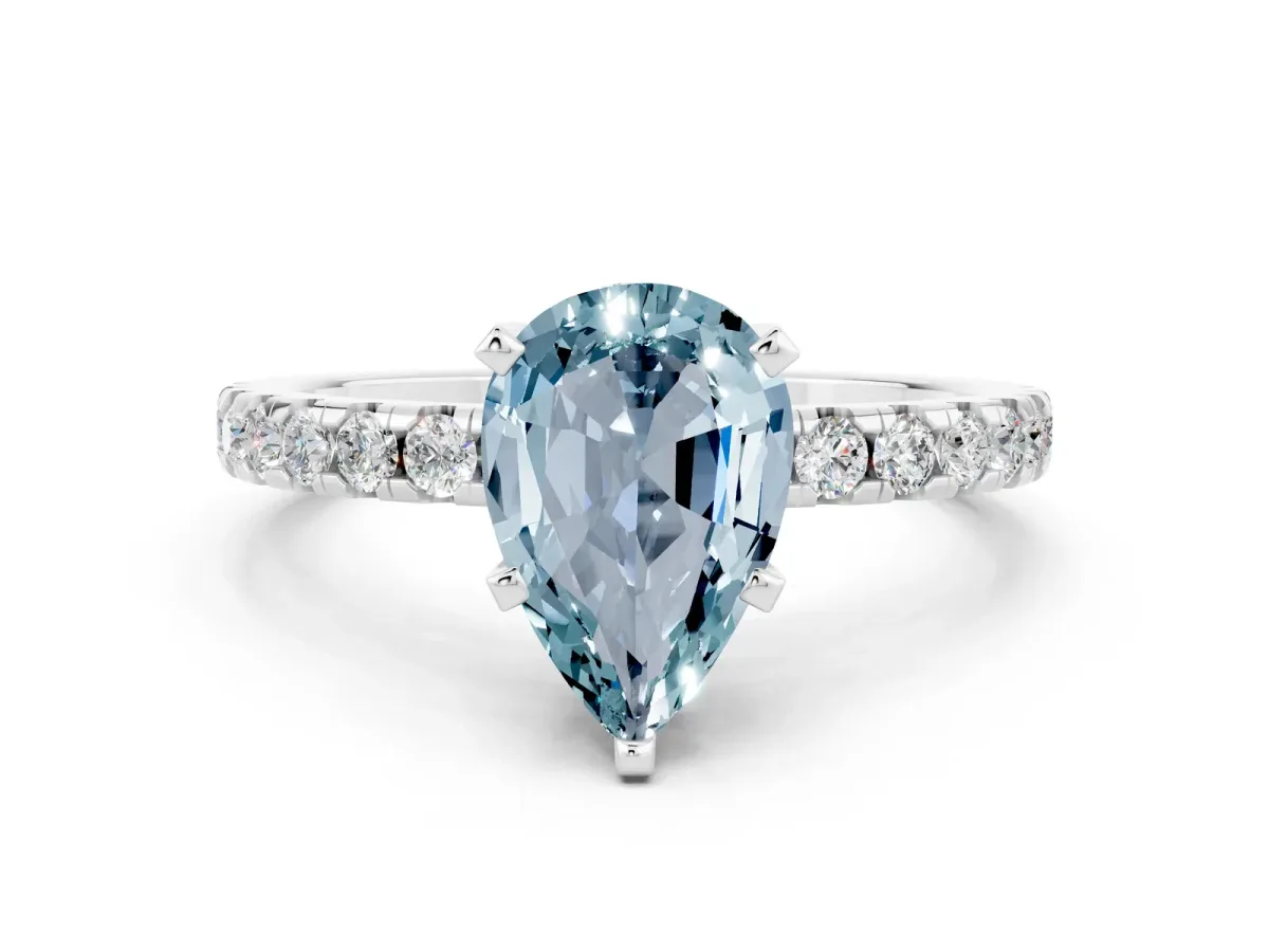 Pear Cut Aquamarine Solitaire Ring with Round Pavé Band and Four-Prong Setting Silver
