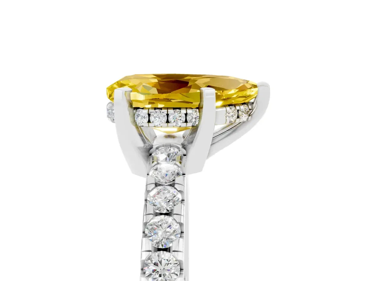 Pear Cut Yellow Sapphire Solitaire Ring with Round Pavé Band and Four-Prong Setting Silver